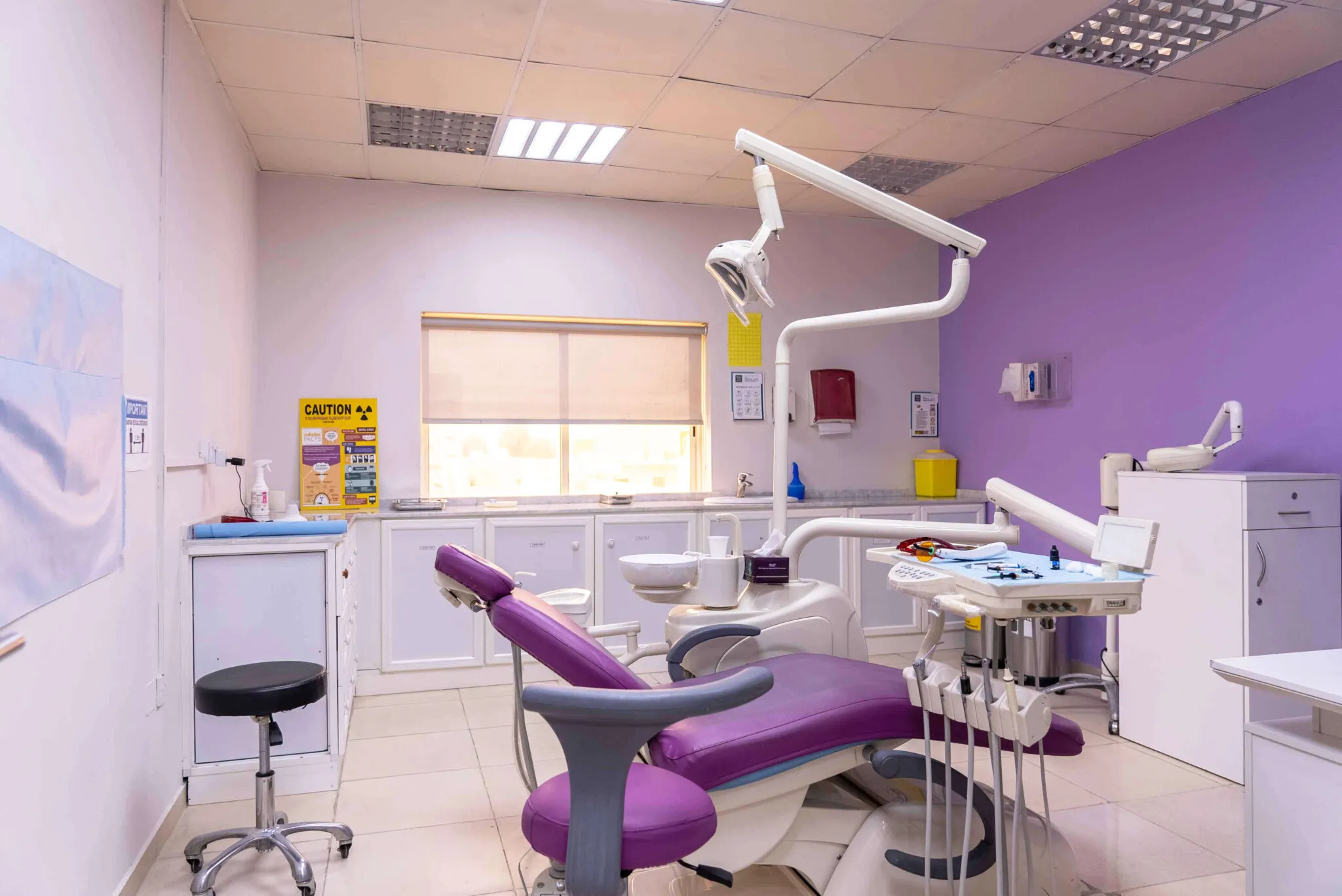 The dental treatment room, with its purple dental chair